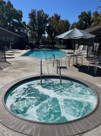 a hot tub in the middle of a swimming pool
